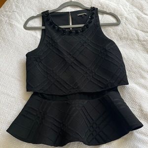 Black peplum tank with beautifully embellished neckline